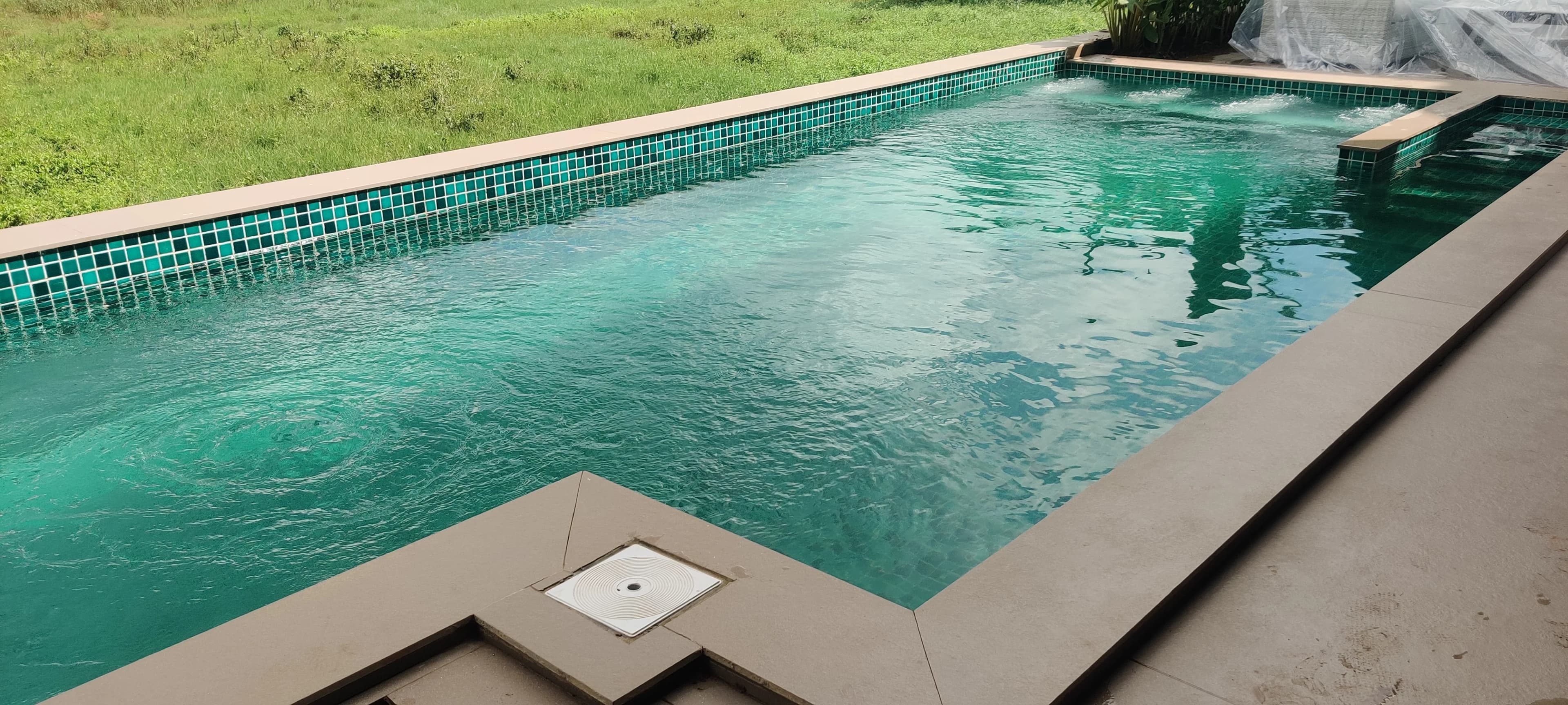 Vivid teal mosaic pool by Dazzling Pools
